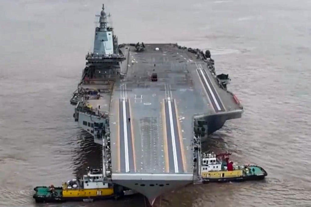 CCTV shows footage of the aircraft carrier Fujian being manoeuvred by tugboats. Photo: CCTV