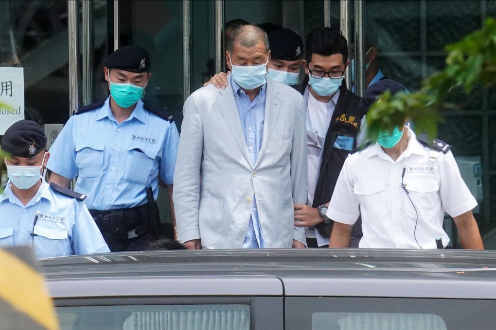 Jimmy Lai (centre) in custody outside Apple Daily’s offices in 2020. Prosecutors have presented 31 examples of allegedly seditious content published by the tabloid between June 2019 and January 2020. Photo: Winson Wong