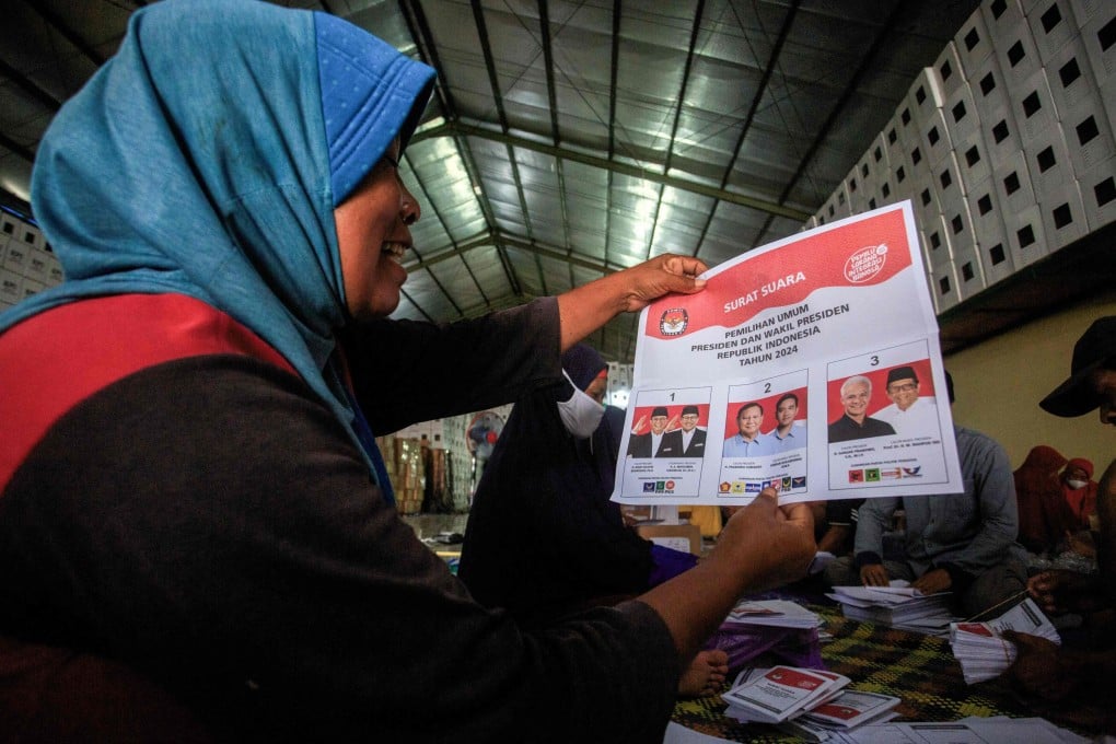 A worker shows a ballot paper for the Indonesian presidential election in Bantul. There are around 250,000 Indonesians in Singapore. Photo: AFP