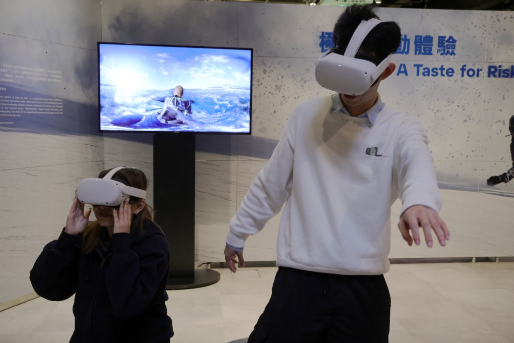 Staff at the Hong Kong Science Museum seen immersing themselves in a virtual reality experience on November 9. 2023. Photo: May Tse