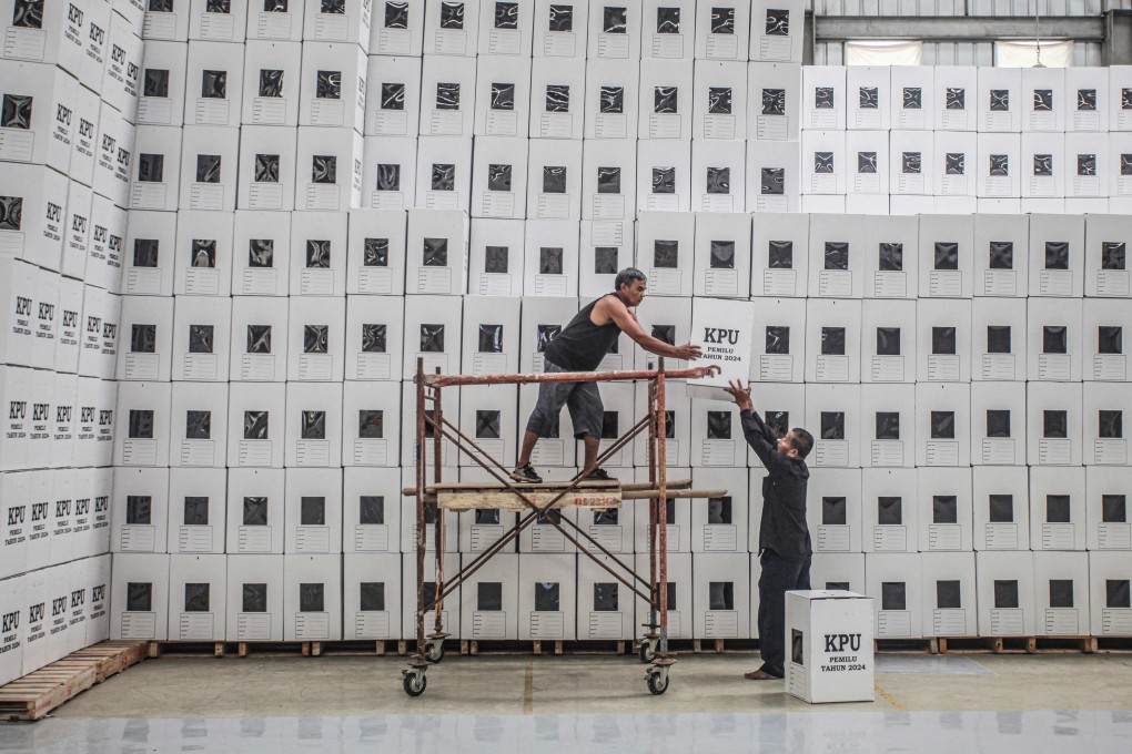 Election workers stack ballot boxes last month at a warehouse in South Sumatra. More than 200 million Indonesians will be eligible to vote in the presidential elections on February 14. Photo: AFP