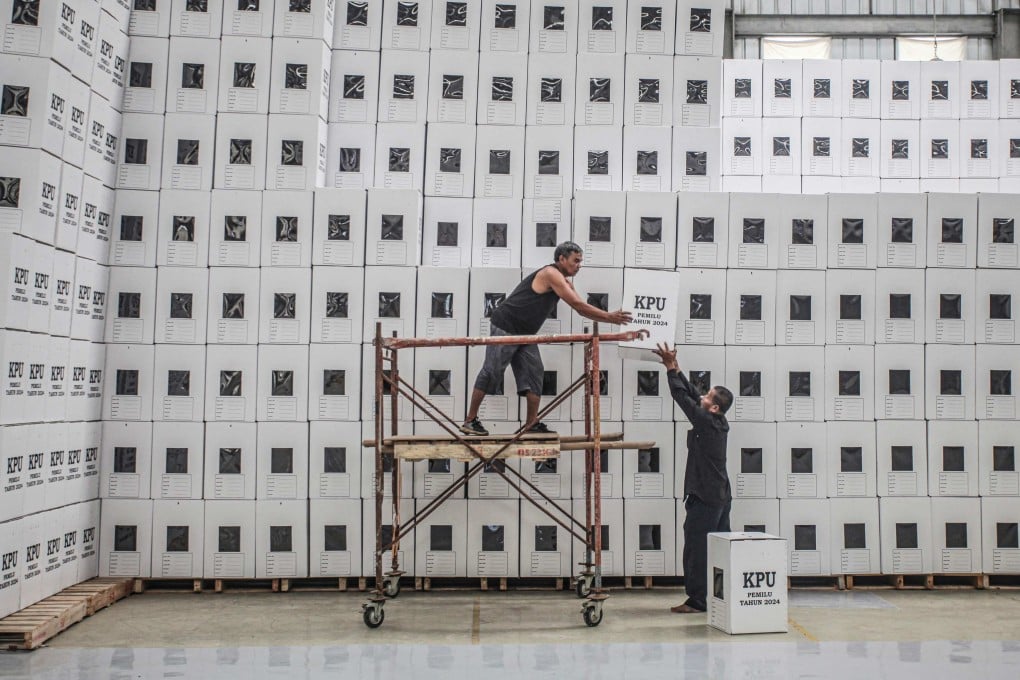 Election workers stack ballot boxes last month at a warehouse in South Sumatra. More than 200 million Indonesians will be eligible to vote in the presidential elections on February 14. Photo: AFP