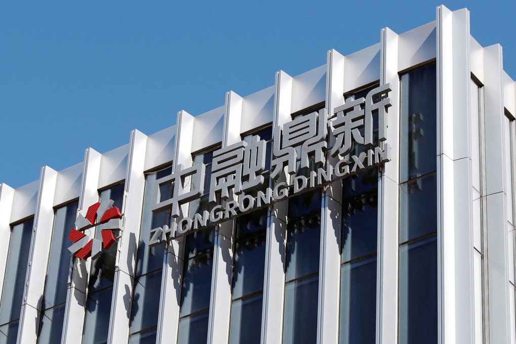 The logo of Zhongrong Dingxin is seen on the office building of Zhongrong International Trust, a trust company partially owned by Zhongzhi Enterprise Group, in Beijing. Photo: Reuters