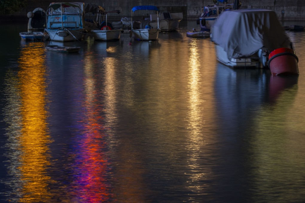 Light is reflected off the water at the Causeway Bay Typhoon Shelter, the oldest in Hong Kong. Photo: Antony Dickson