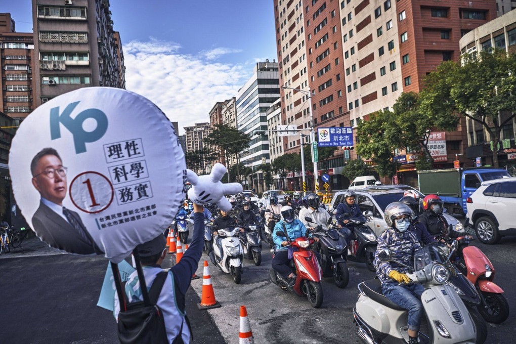 A young campaigner encourages support for Ko Wen-je, the TPP candidate in next week’s presidential election in Taiwan. Photo: Bloomberg
