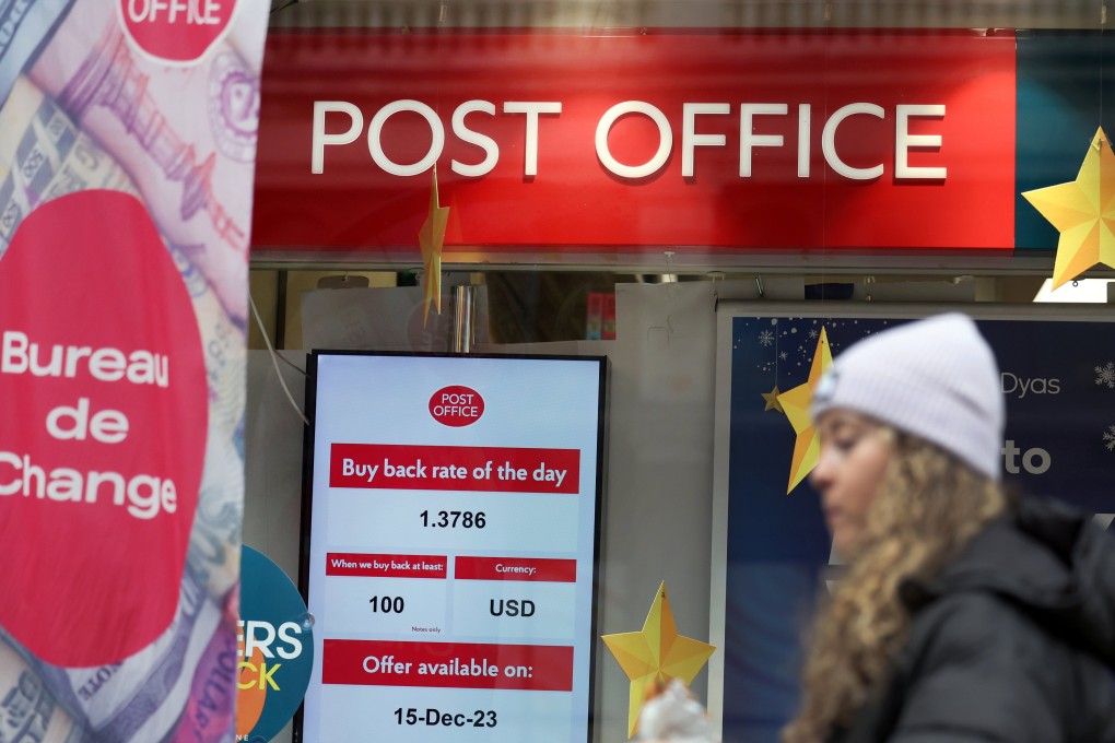A pedestrian walks past a Post Office in London. Faulty accounting systems at Britain’s Post Office meant that over 700 postal workers were wrongly convicted of theft and fraud, with many ending up in prison. Photo: EPA-EFE