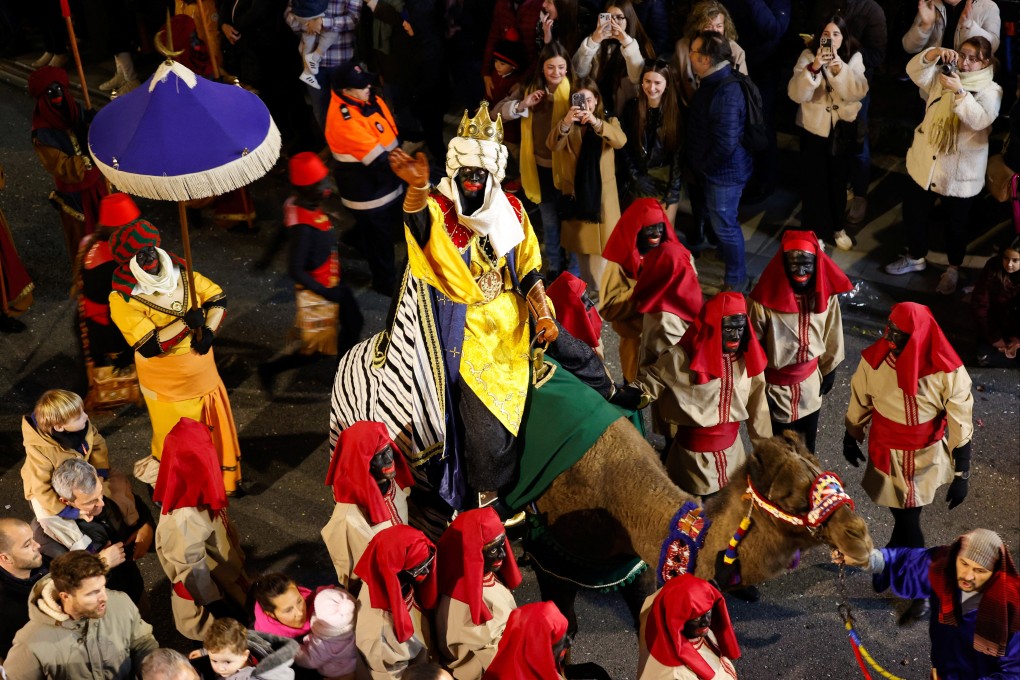 Participants dressed in costumes and wearing blackface take part in the annual Epiphany eve parade of the Three Kings, in Alcoy, Spain, on Friday. Photo: Reuters