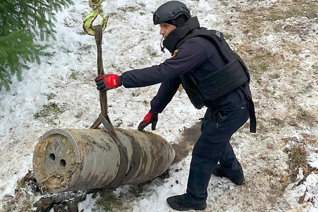 Sappers of the Rapid Response Mobile Rescue Centre of the State Emergency Service of Ukraine neutralising the warhead of a Kinzhal missile in Kyiv on Friday. Photo: Handout / State Emergency Service of Ukraine / AFP / XGTY