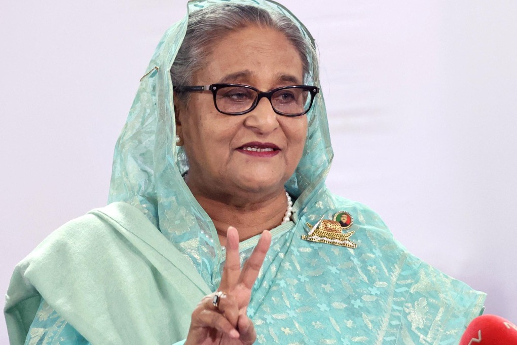 Sheikh Hasina, Prime Minister of Bangladesh and Chairperson of Bangladesh Awami League, shows a victory sign while speaking to the press after casting her vote at the Dhaka City College center during the 12th general election in Dhaka, Bangladesh on Sunday. Photo: Prime Minister’s office/Handout via Reuters