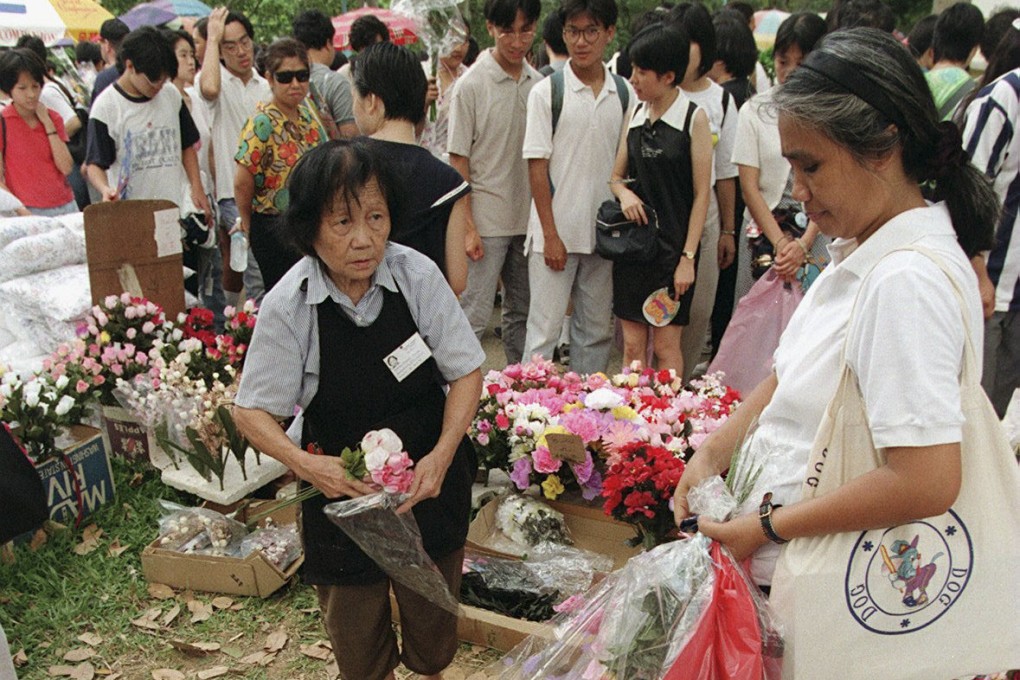An artificial-flower seller at Shek Kong Friday market on its final day in 1996. The weekly bazaar was a favourite of British service wives living in married quarters near the then remote village, but in closing down it became reduced to mere memory for those who shopped there. Photo: SCMP