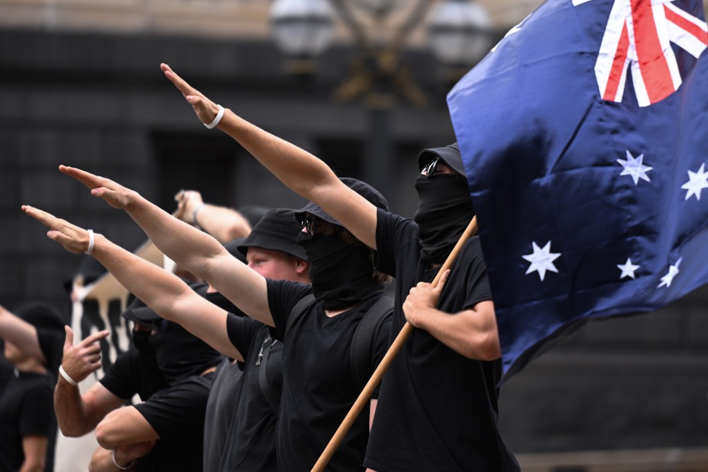 Neo-Nazis in Melbourne perform the Nazi salute at a transgender rights rally in March last year. New laws that came into effect in Australia on Monday make the salute an offence punishable by up to 12 months in prison. Photo: EPA-EFE