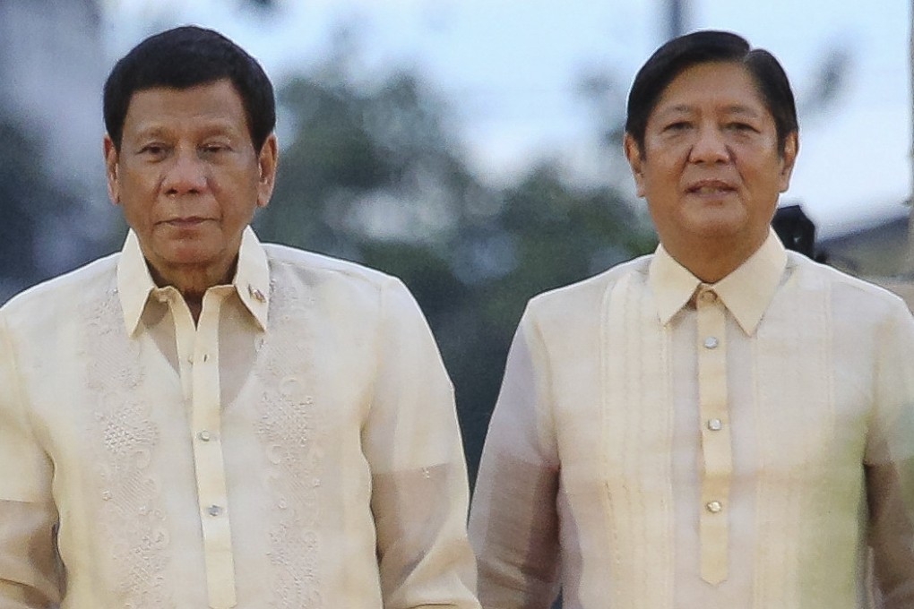 Outgoing Philippine President Rodrigo Duterte (left) stands beside incoming Philippine President Ferdinand Marcos Jnr as they attend the oath taking rites of Vice-President elect Sara Duterte in Davao city, southern Philippines on June 19, 2022. Photo: AP