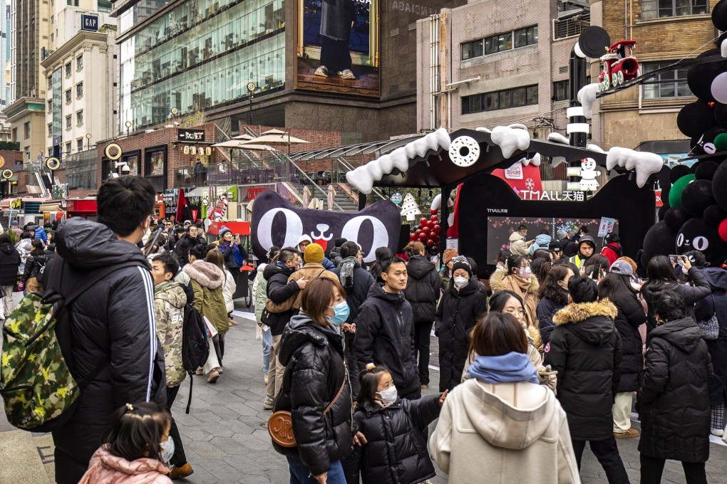 Visitors at a holiday market in Shanghai, China. An abrupt surge in foreign buying of Chinese bonds has raised hopes that pessimism about the nation’s assets may be overdone. Photo: Bloomberg