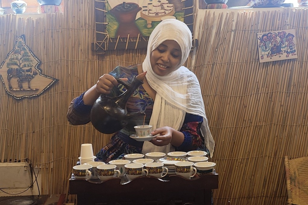 An Ethiopian barista prepares a welcome drink at the Dubai Coffee Museum in the United Arab Emirates. The museum features the history, production processes and cultures surrounding the drink around the world through books, roasters, grinders, serving pots, mugs and other items. Photo: Riddhi Doshi