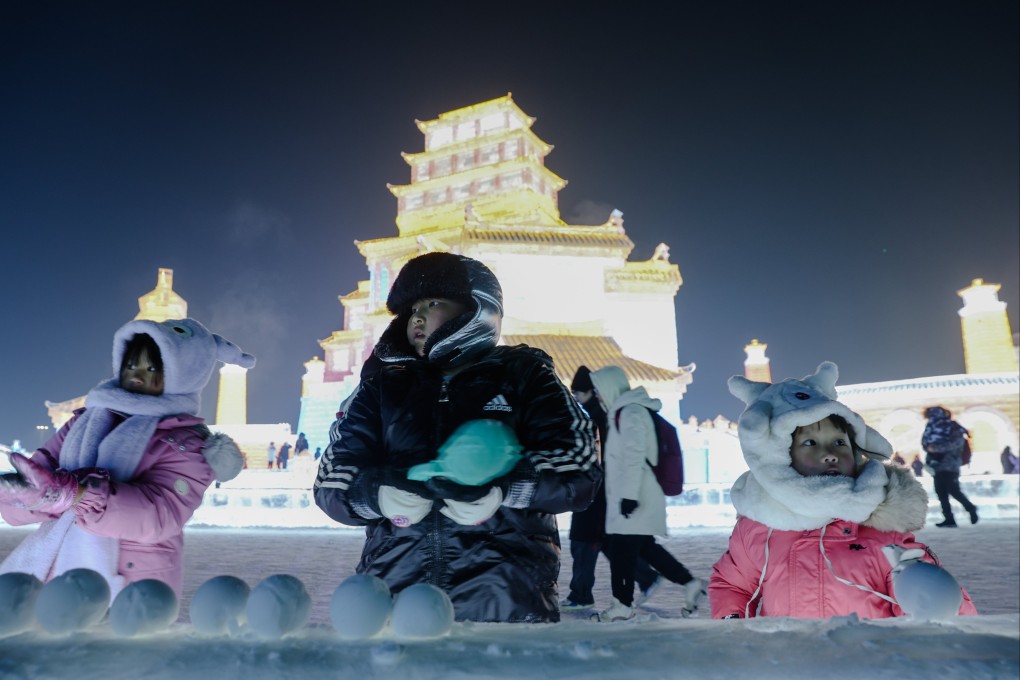 Visitors enjoy the annual ice festival in Harbin, Heilongjiang, northeast China. The country’s frozen northern regions are experiencing a boom in domestic winter tourism, bringing much-needed income after the coronavirus pandemic. Photo: EPA-EFE