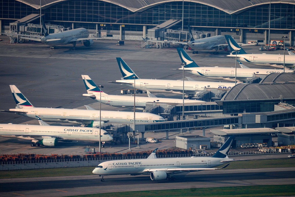Cathay Pacific planes in Hong Kong. The carrier cancelled at least 21 flights on Tuesday, almost double the average of 12 a day it had a pledged. Photo: Sam Tsang