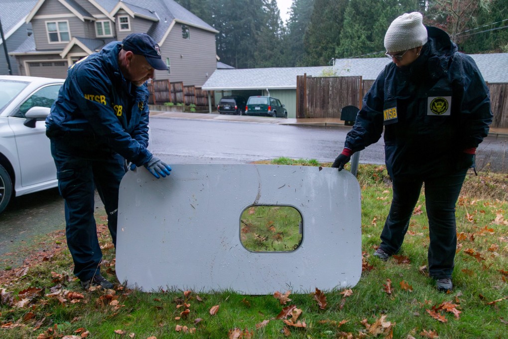 Investigators examine the fuselage panel where it was recovered in Portland, Oregon. Photo: NTSB via Reuters