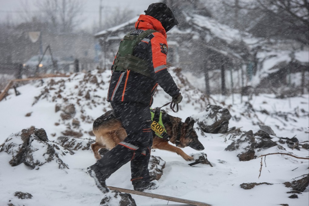 A rescuer with a dog works at the site of a Russian missile strike in the town of Pokrovsk, Donetsk region, Ukraine on Monday. Photo: Reuters