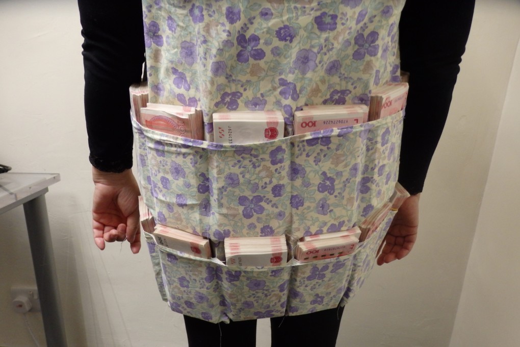 A Hong Kong woman was arrested after hiding HK$330,000 worth of Chinese yuan in a vest. Photo: Handout