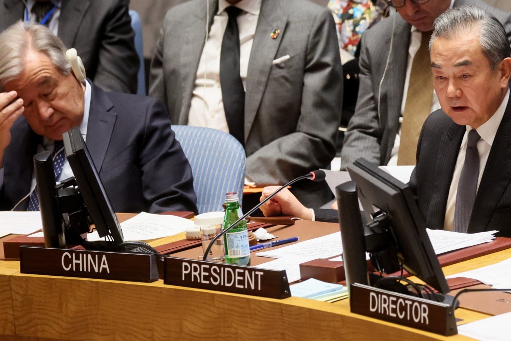 Chinese Foreign Minister Wang Yi (right) and United Nations Secretary General Antonio Guterres attend a UN Security Council meeting on the conflict between Israel and Hamas in New York on November 29, 2023. Photo: Reuters
