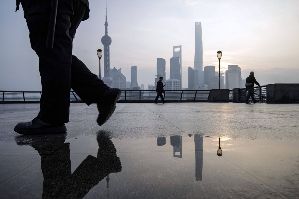 Pedestrians walk on the Bund in front of buildings in Pudong’s Lujiazui Financial District in Shanghai on January 9, 2024. Photo: Bloomberg