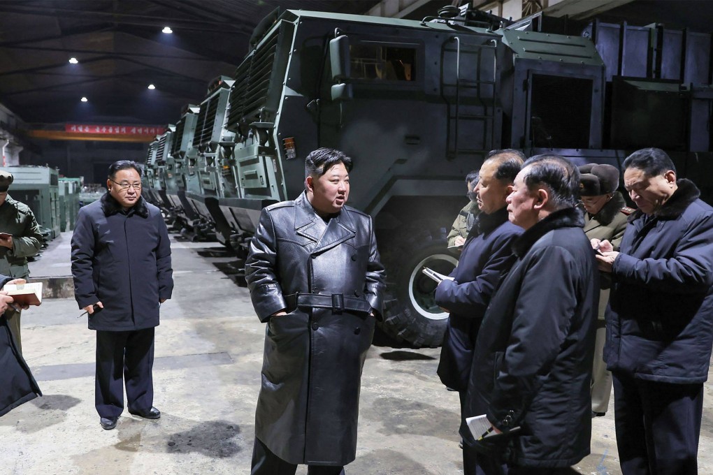 North Korean leader Kim Jong-un (centre) inspects a major munitions factory at an undisclosed location in North Korea. Photo: KCNA via KNS/AFP