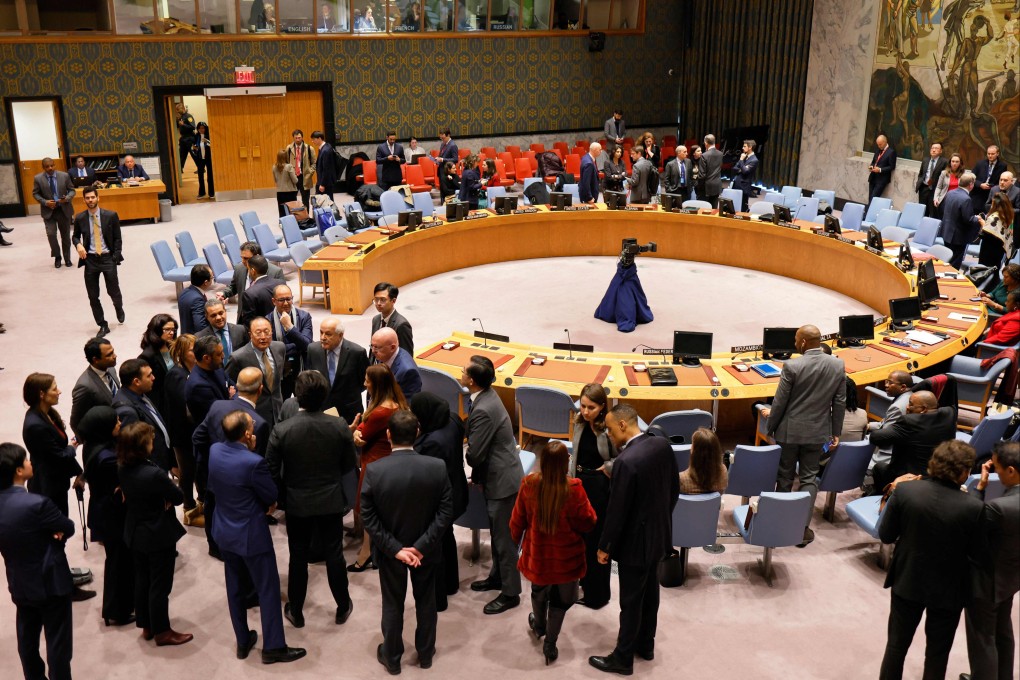 Palestinian ambassador to the United Nations Riyad Mansour is surrounded as members of the UN Security Council hold sideline meetings during a break at the organisation’s headquarters in New York on December 19. Photo: Getty Images/AFP