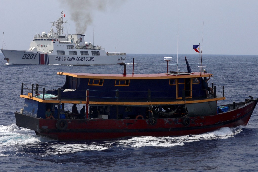 A Chinese coastguard ship sails near a Philippine vessel in disputed waters in the South China Sea on October 4, 2023. The growing number of close calls between ships from the two countries in the South China Sea has raised concerns about an accident possibly spilling over into armed conflict. Photo: Reuters
