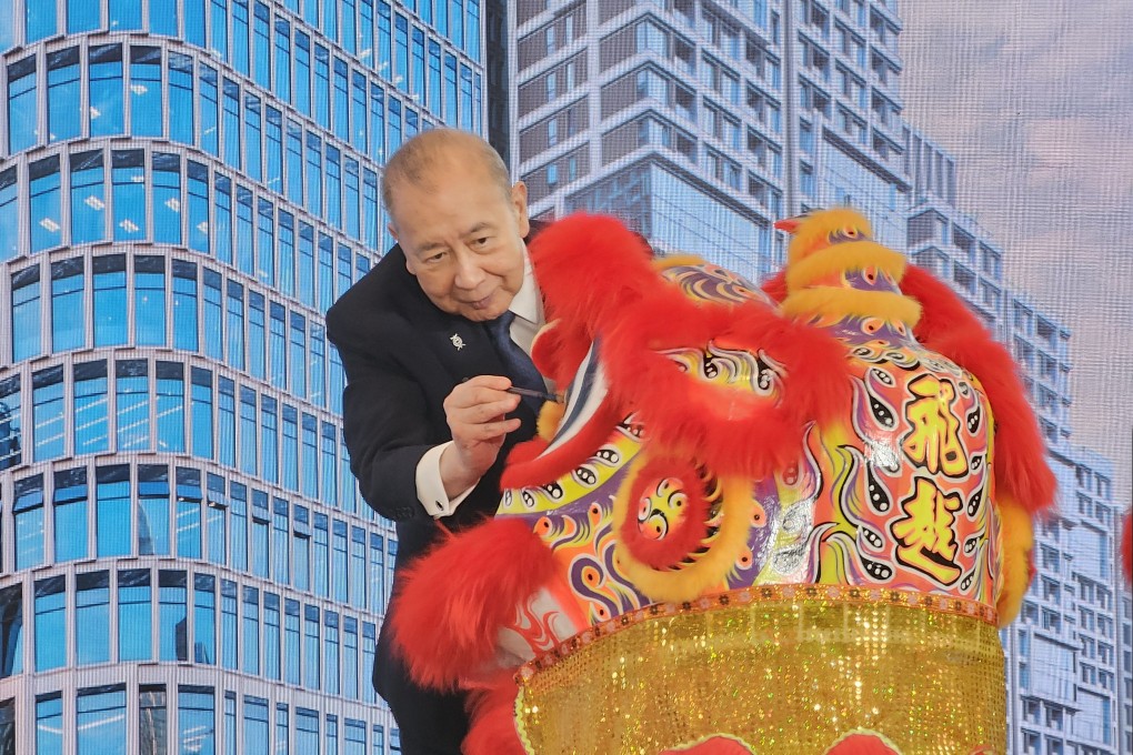 Bank of East Asia executive chairman David Li dots the eye of a lion before the ceremonial lion dance at the inauguration of the BEA Tower in Qianhai, Shenzhen, on Friday. Photo: Enoch Yiu