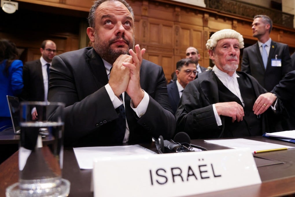 Legal adviser to Israel’s Foreign Ministry Tal Becker and British jurist Malcolm Shaw sit inside the International Court of Justice (ICJ) as judges hear a request for emergency measures to order Israel to stop its military actions in Gaza, in The Hague, Netherlands on Friday. Photo: Reuters