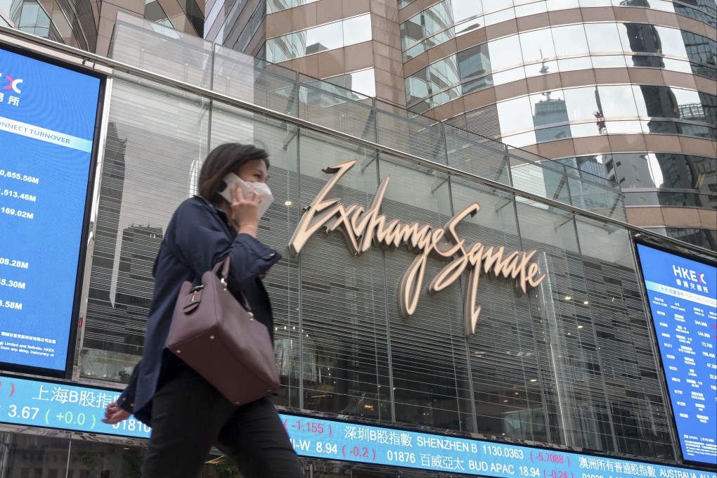 A woman walks by the Exchange Square complex, which houses the Hong Kong stock exchange, in October 2022. Photo: Getty Images