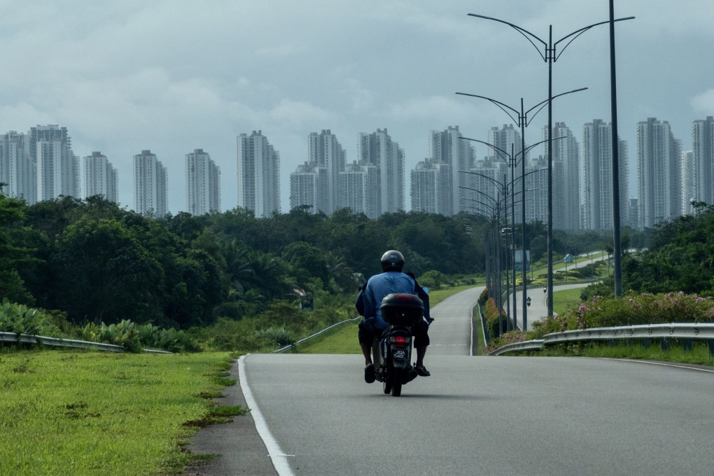 A view of the Forest City development in Johor seen in the distance from an approach road. Photo: Hadi Azmi