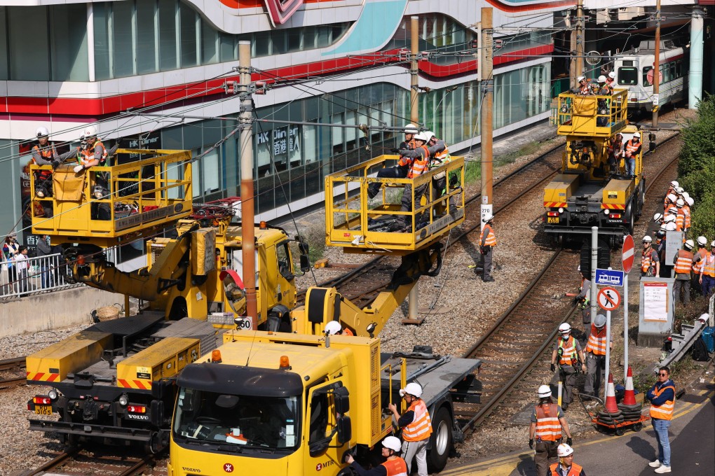 Workers carry out repair work after a damaged overhead cable in Tuen Mun disrupted light rail services. Photo: Dickson Lee