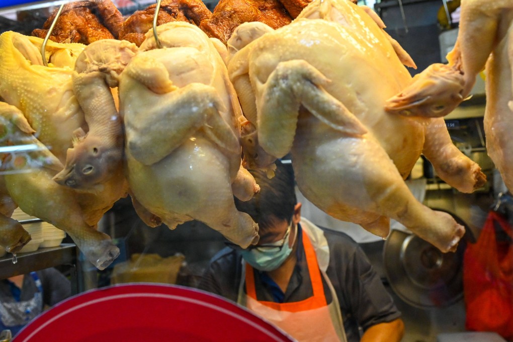 A vendor prepares chicken rice at a hawker centre in Singapore. File photo: AFP
