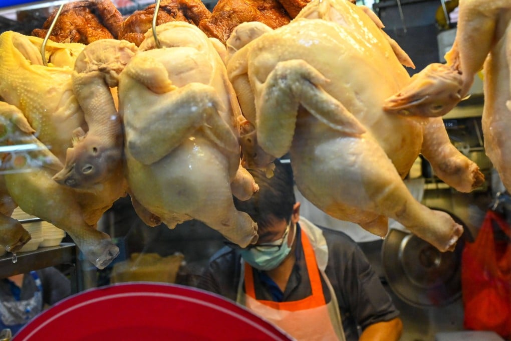 A vendor prepares chicken rice at a hawker centre in Singapore. File photo: AFP