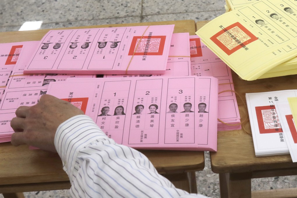 A poll worker sorts ballots in Taipei, Taiwan on Saturday. Photo: AP