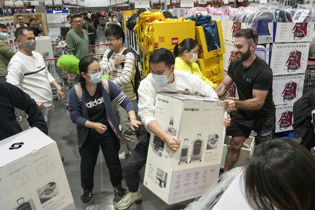 Sets of Samsonite luggage fly off the shelves on the second day of sales at the new Costco warehouse store in Shenzhen. Photo: Eugene Lee