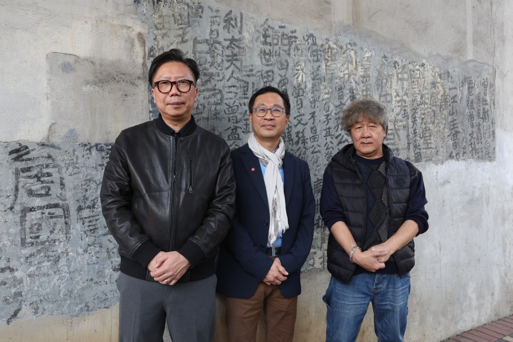 (From left) John Lau, IDG Design and Engineering project manager, Cheng Kwok-wai, MTR Corp senior project architectural manager, and Fong Tam, an artwork restoration specialist in front of calligraphy by Tsang Tsou-choi in Mong Kok. Photo: Edmond So
