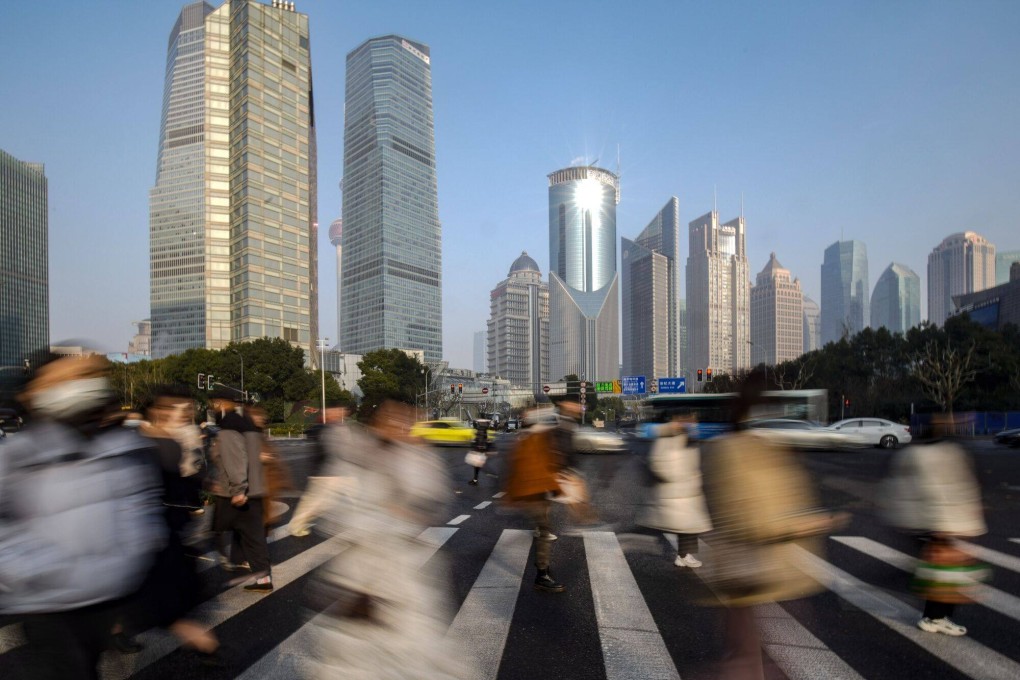 Pedestrians cross a road in Pudong’s Lujiazui Financial District in Shanghai, China on January 9, 2024. Photo: Bloomberg