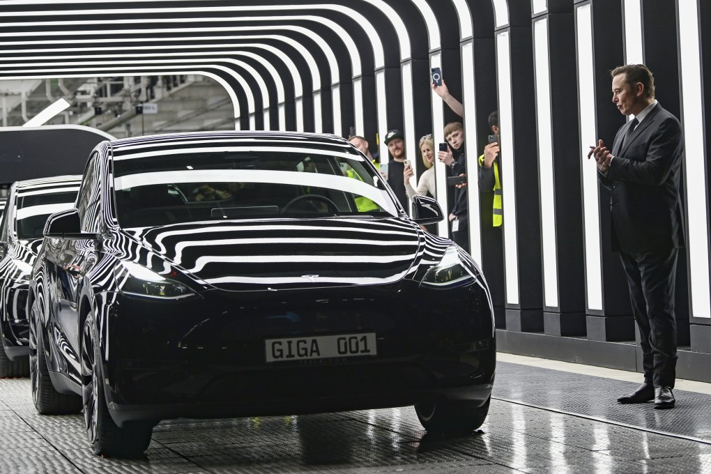 Tesla chief executive Elon Musk applauds the roll-out of new electric vehicles at the opening of the firm’s Gigafactory Berlin-Brandenburg plant in Germany on March 22, 2022. Photo: AP