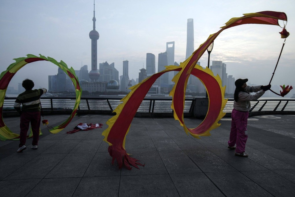 People fly dragon-shaped kites on the Bund in front of buildings in Pudong’s Lujiazui Financial District in Shanghai on January 9, 2024. China’s stock market suffers from a lack of positive drivers ahead of the Lunar New Year. Photo: Bloomberg