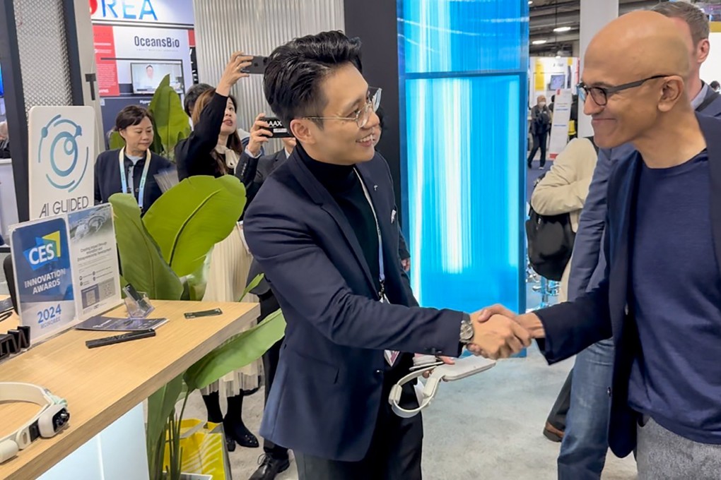 Microsoft CEO Satya Nadella meets with Steve Kong, co-founder and chief technology officer of AI Guided, at CES to learn more about the Hong Kong start-up’s belt for guiding the blind. Photo: Handout