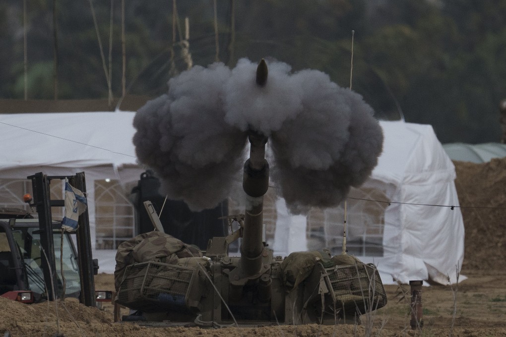 An Israeli mobile artillery unit fires a shell from southern Israel towards the Gaza Strip. Photo: AP