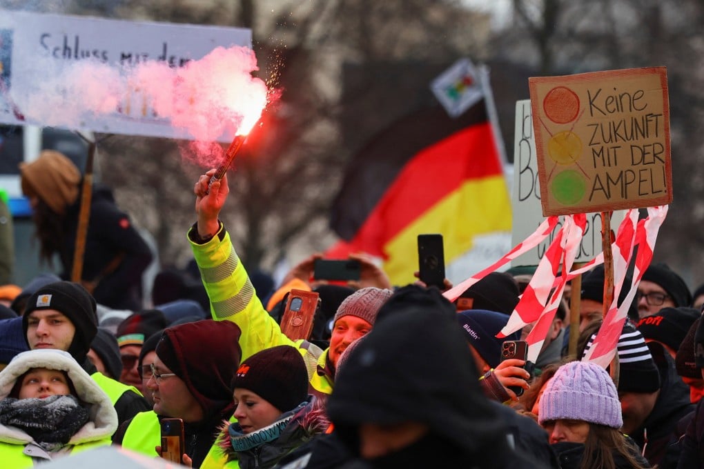 German farmers protest against the cut of vehicle tax subsidies of the so-called German Ampel coalition government in front of the Brandenburg Gate in Berlin. Photo: Reuters
