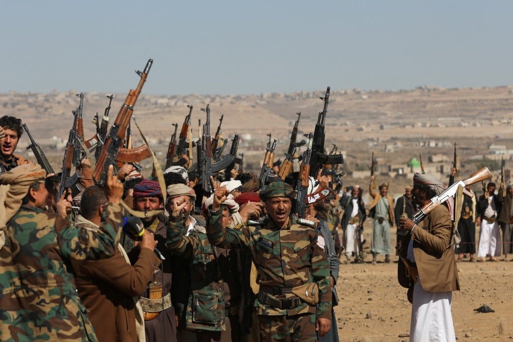 Houthi fighters and tribal supporters during a protest against recent US-led strikes on Houthi targets, near Sanaa, Yemen, on Sunday. Photo: Reuters