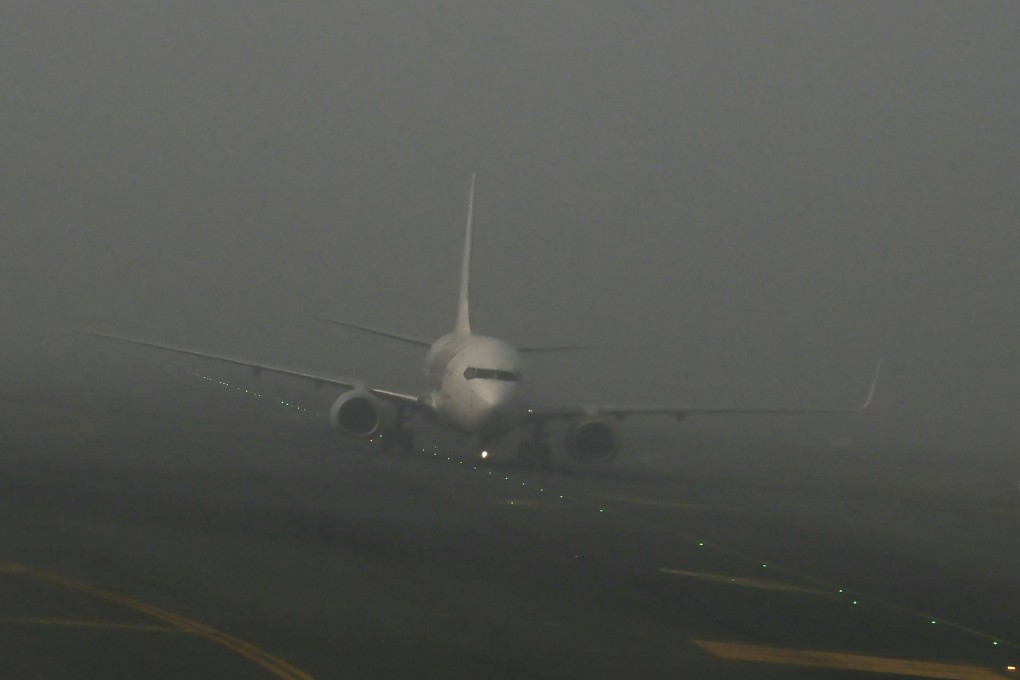 An aircraft prepares to take off amid dense fog at Indira Gandhi International Airport in New Delhi. File photo: AFP