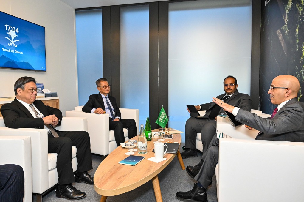 Hong Kong finance chief Paul Chan (second left) and Saudi finance minister Mohammed al-Jadaan (right) meet at Davos in Switzerland. Photo: ISD