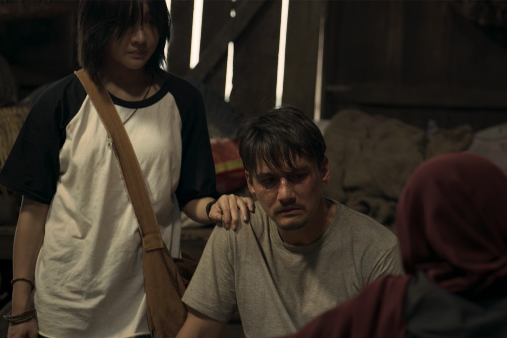 Jennis Oprasert (left) and Ananda Everingham in a still from “The Cursed Land”. The new Thai-Malay language horror film explores Thai Muslim culture and Islamic beliefs. Photo: Courtesy of Panu Aree/Neramitnung Film