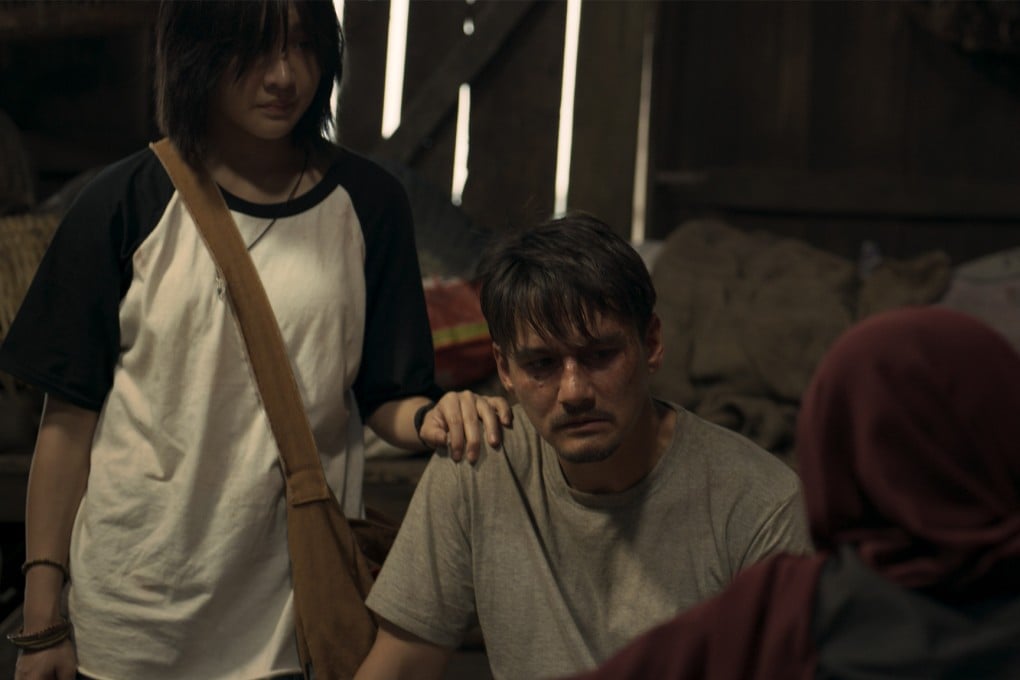 Jennis Oprasert (left) and Ananda Everingham in a still from “The Cursed Land”. The new Thai-Malay language horror film explores Thai Muslim culture and Islamic beliefs. Photo: Courtesy of Panu Aree/Neramitnung Film