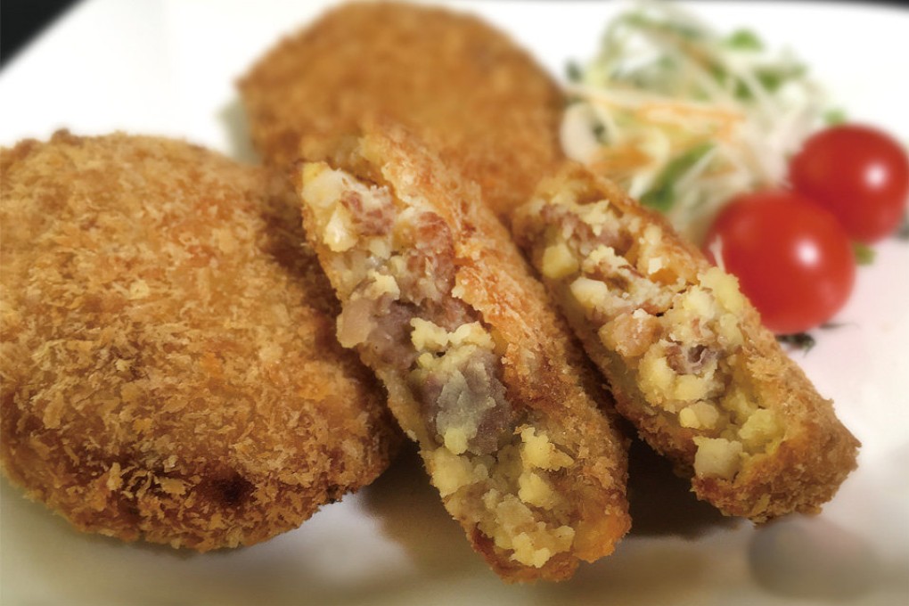 The deep-fried beef and potato dumplings at Asahiya have for years attracted a fanatical following across Japan for the cubes of grade A5 Kobe beef. Photo: Handout